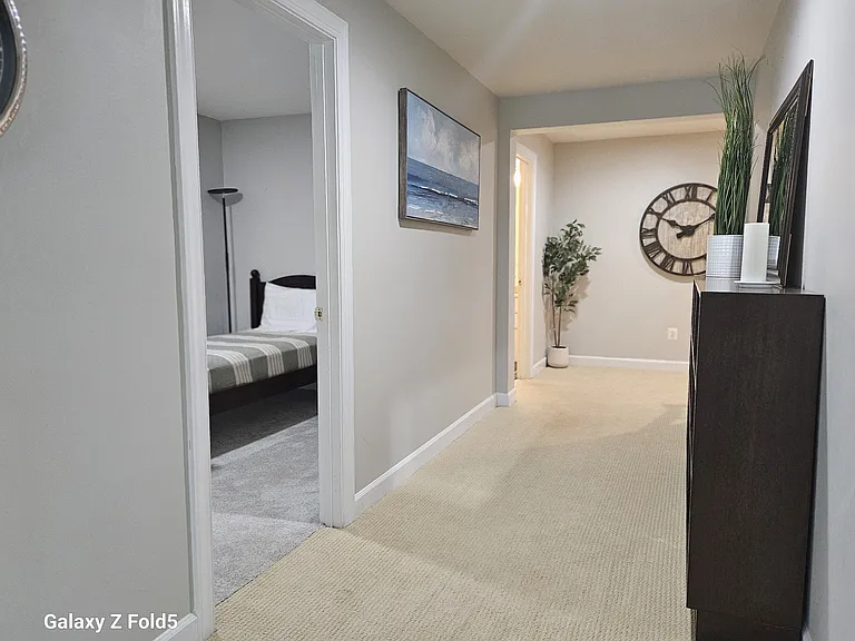 Hallway leads to twin bedroom one on left.