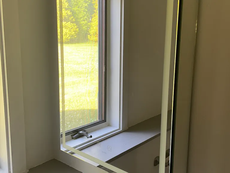 New paint, mirror and faucet in downstairs bathroom.
