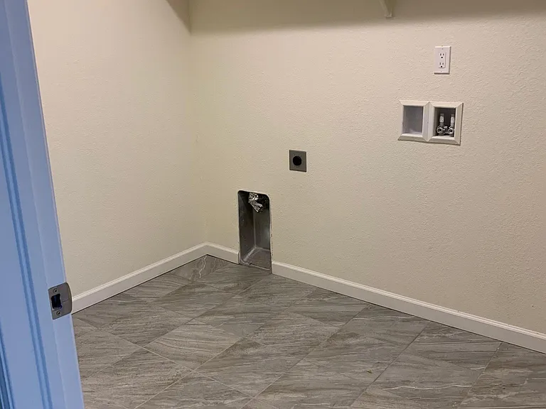 spacious laundry area, new front load washer and dryer installed (after photo was taken)