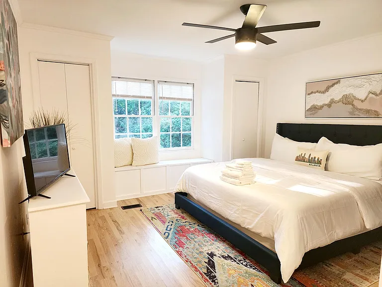 Master bedroom (king size bed) with access to backyard and master bathroom