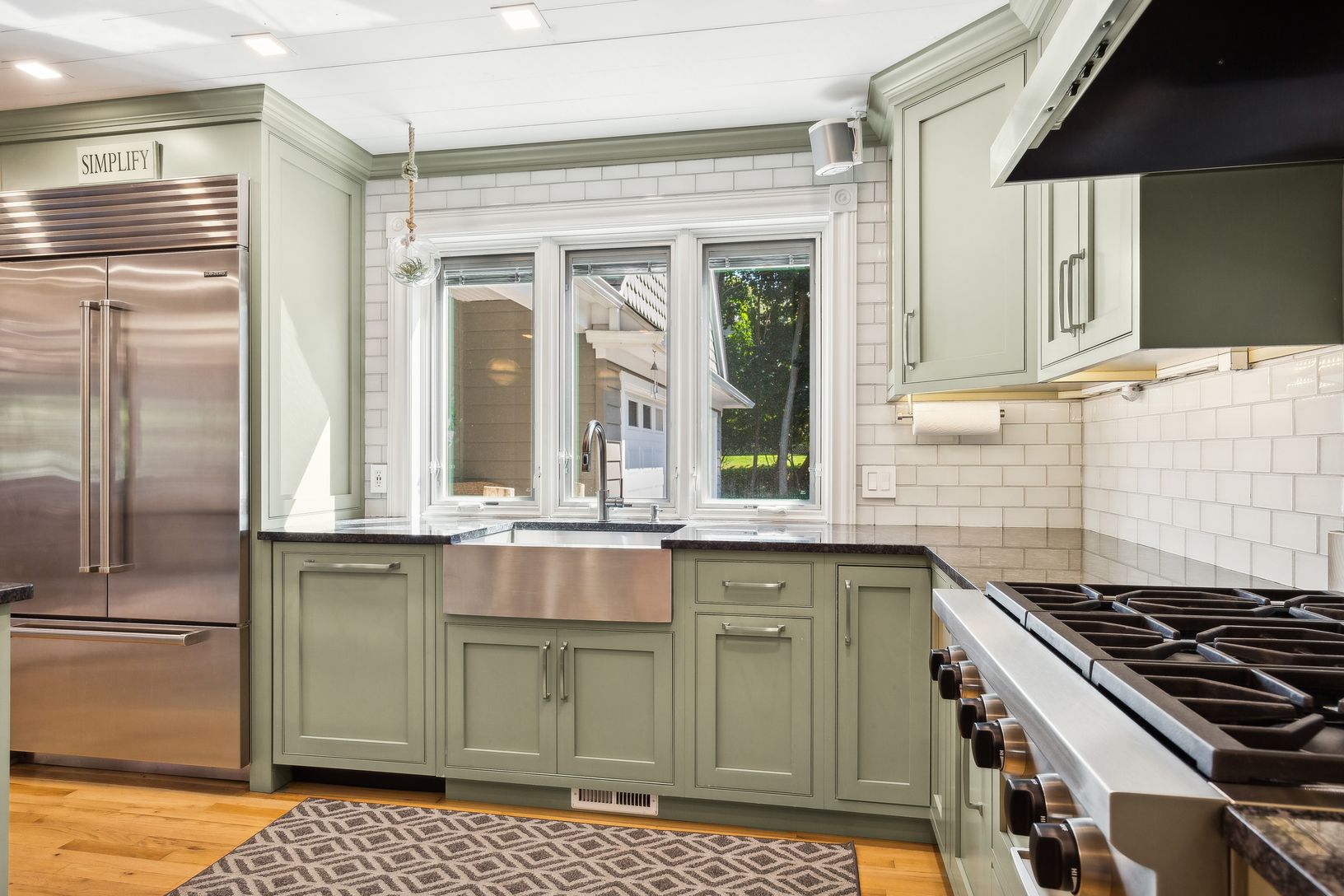  Kitchen Featuring Stainless Steel Appliances, Black Granite Countertops, Wolf 6 Burner Gas Cooktop