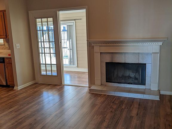 Living Room with wood burning fireplace and small closet