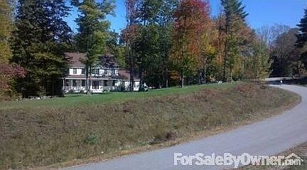 House as seen from street
						:
						Yard is large and has lovely areas for fire pit, hammock, etc.