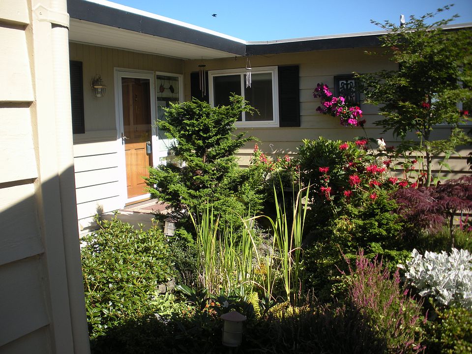 Front door beyond water feature