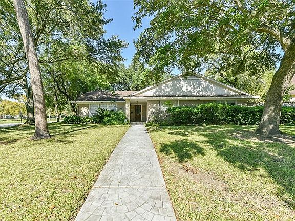 Mature trees and beautiful landscaping adorn this lot.