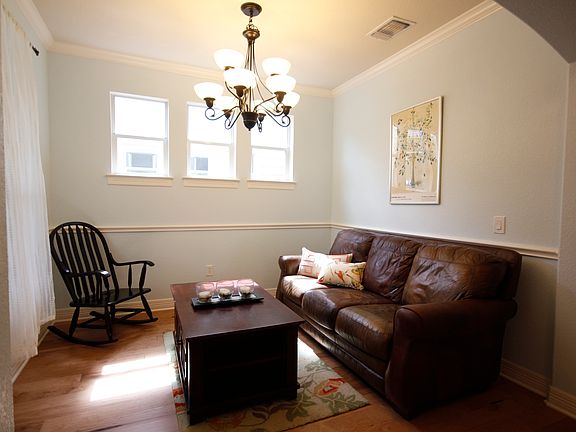Formal dining room up front, can be used a second living spa