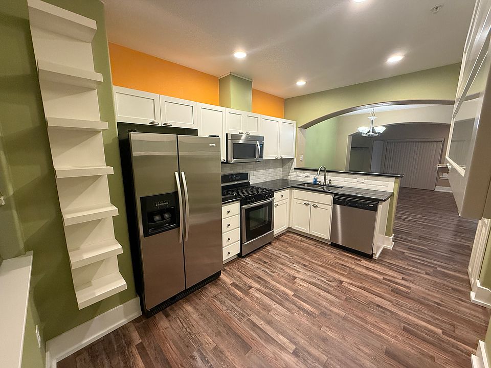 Kitchen featuring brand new hardwood flooring