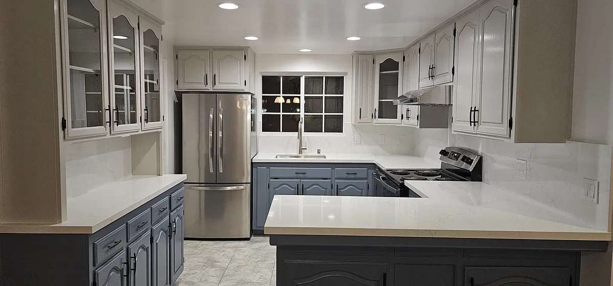 Updated kitchen with new stove, sink, quartzite countertop, and canister lighting. - 3181 Coldwater Dr
