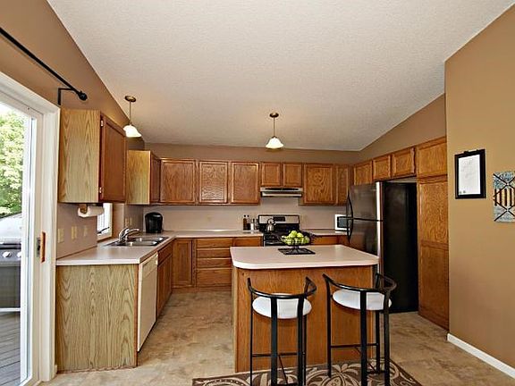 Huge open kitchen with newer flooring, stainless steel appliance and tons of storage!
