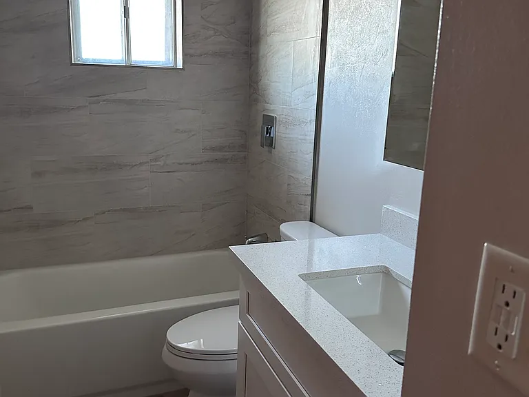 Hall bath, new tub/surround, toilet, cabinets, countertops