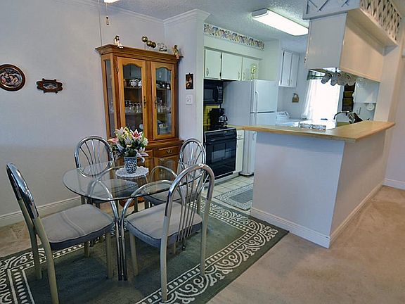  Entry to the condo is the dining room and kitchen.