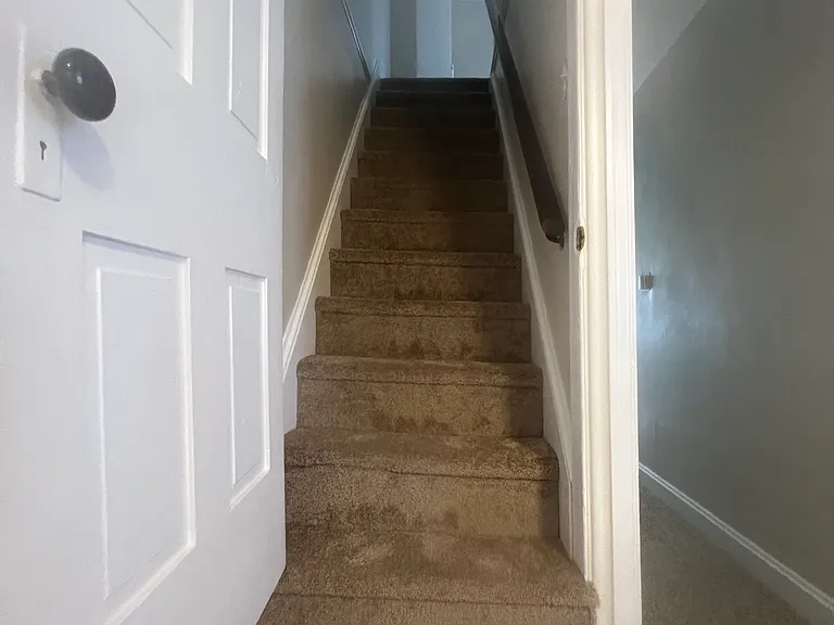 stairs to additional large bedroom/loft