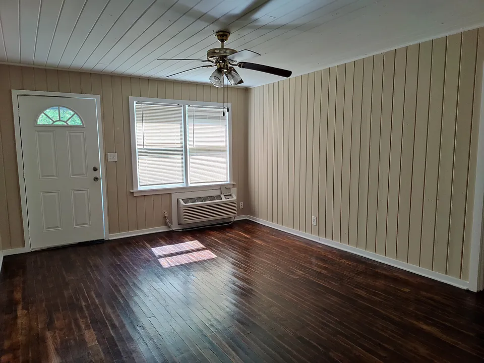 Spacious living room with hardwood floor
