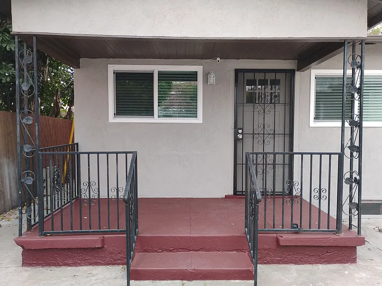 Newly painted home has private front porch.