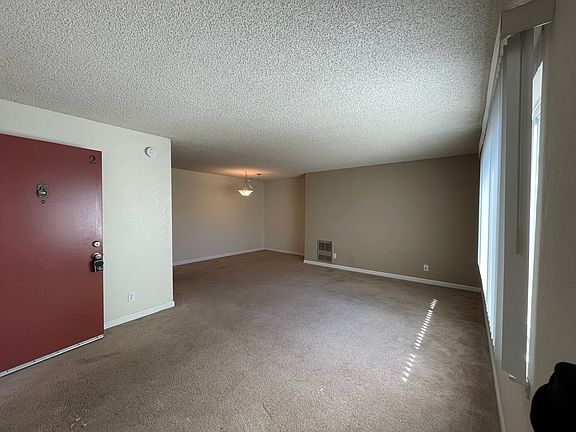 Enter into large living space flowing into the Dining Room.