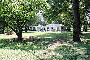 BACK OF HOME OVERLOOKING CREEK
