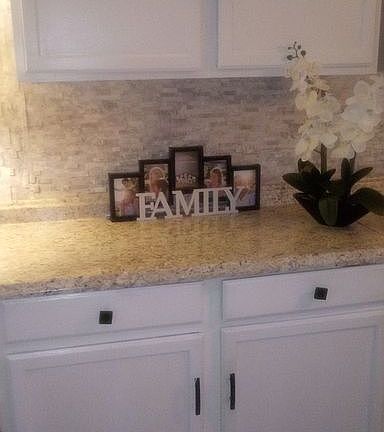 Kitchen with Mosaic backsplash.