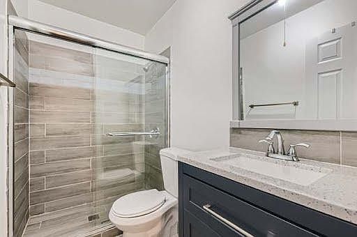 Full bathroom with glass door