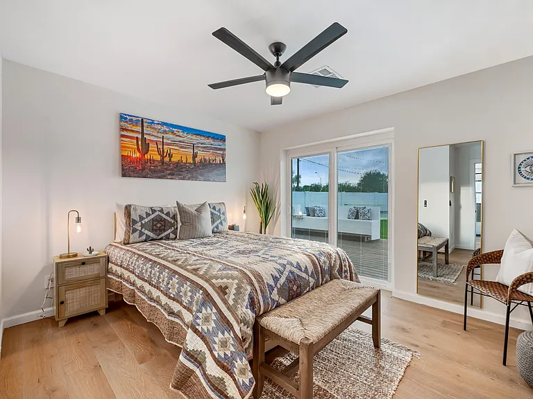 Bedroom #2: Queen bed overlooking backyard. Uses hallway bath, twin trundle