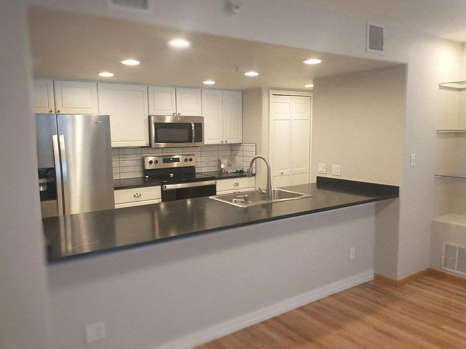 Remodeled
 Kitchen with countertop seating