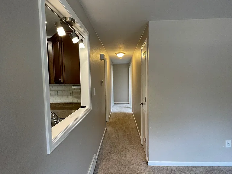 Hallway to bedrooms and bathroom.