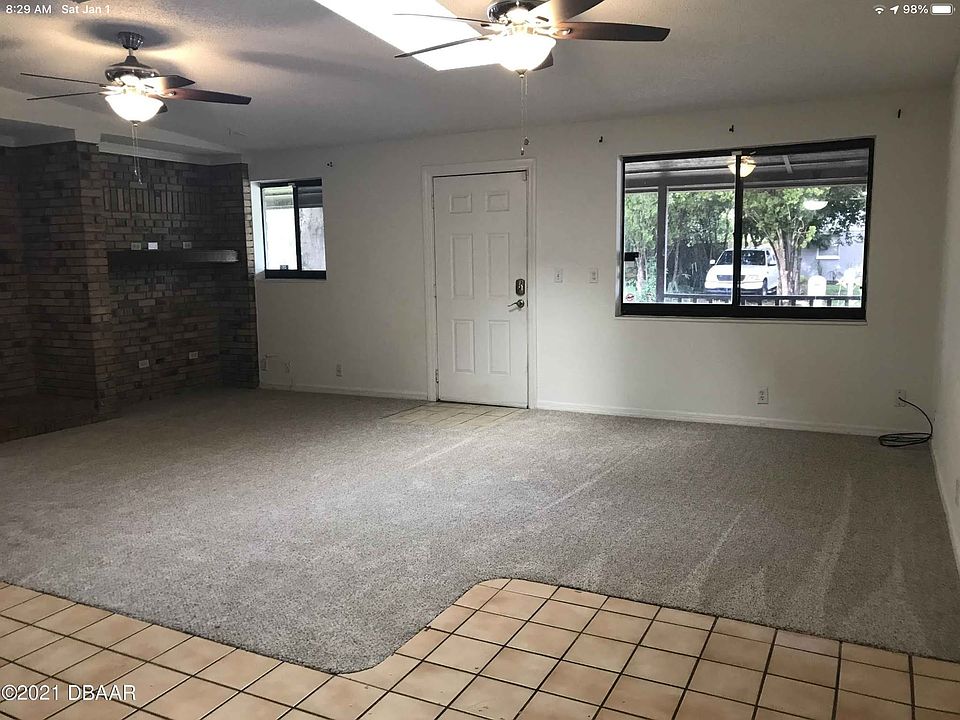 Second view of the living room, you can see the brick accent wall