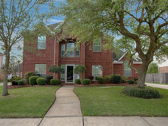 This stately all-brick home makes an outstanding first impression with its architectural design, manicured landscaping and matures trees.