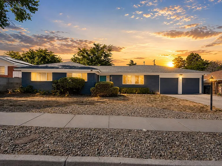 Single-story home with a wide driveway, two-car garage, and low-maintenance front landscaping.