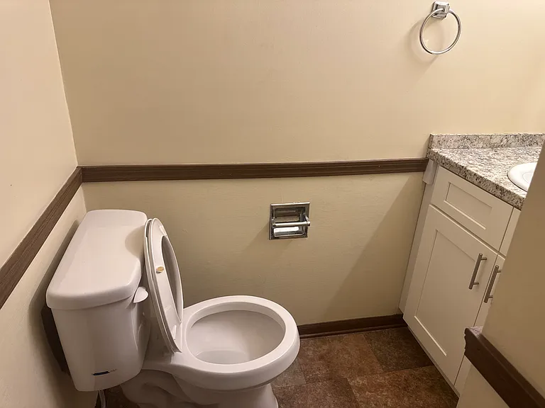 Half bath on first floor between living and kitchen