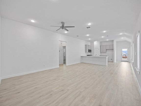 Living Room in the Pecan II home plan by Trophy Signature Homes - REPRESENTATIVE PHOTO