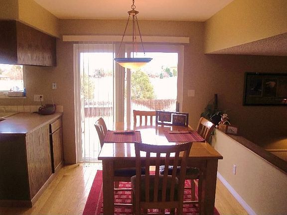 Eating area with sliding door to massive trex deck