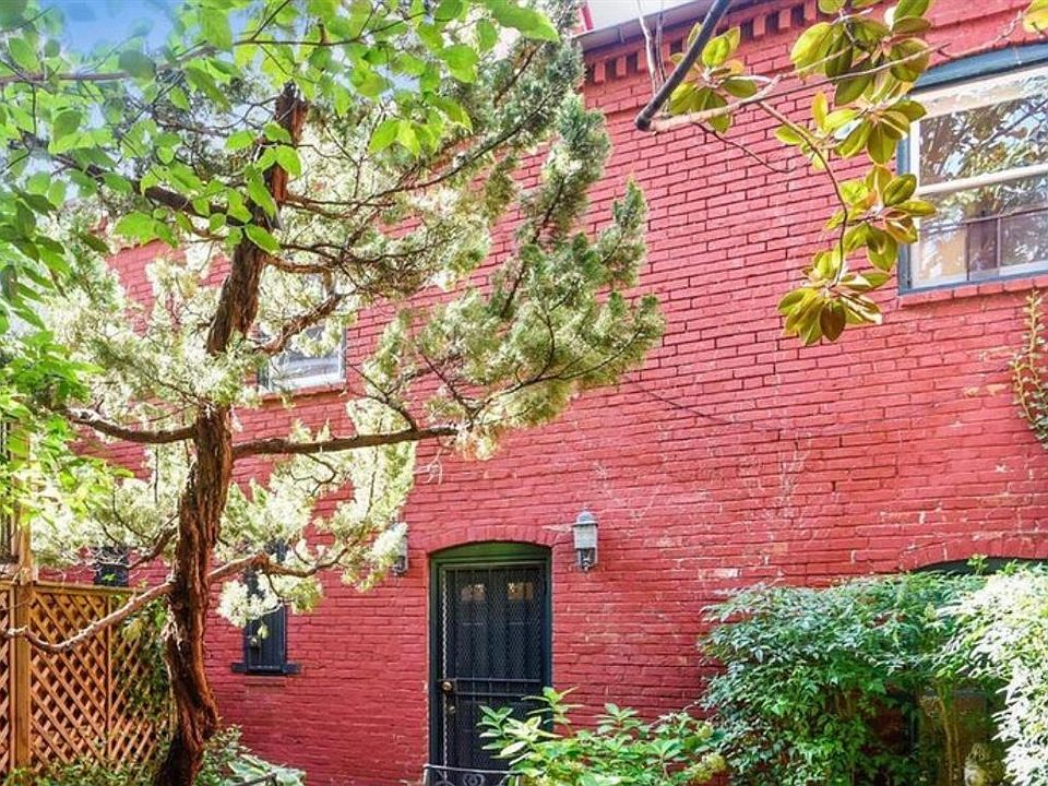 Exterior of the carriage house overlooking gated courtyard