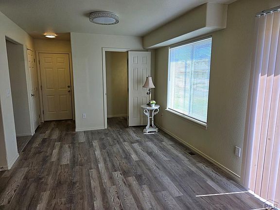 Family room adjacent to kitchen and leading to backyard