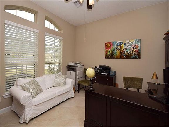 Behind the French Doors is a large study that can easily be a home office, a formal living or a comb