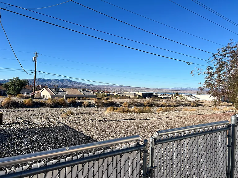 Privacy behind the home: nature/wash land that will not be developed.
