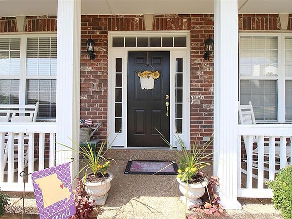 You will love this aggregate wrap-around porch!