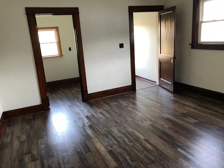 Large bedroom with walk-in closet and small office or storage room