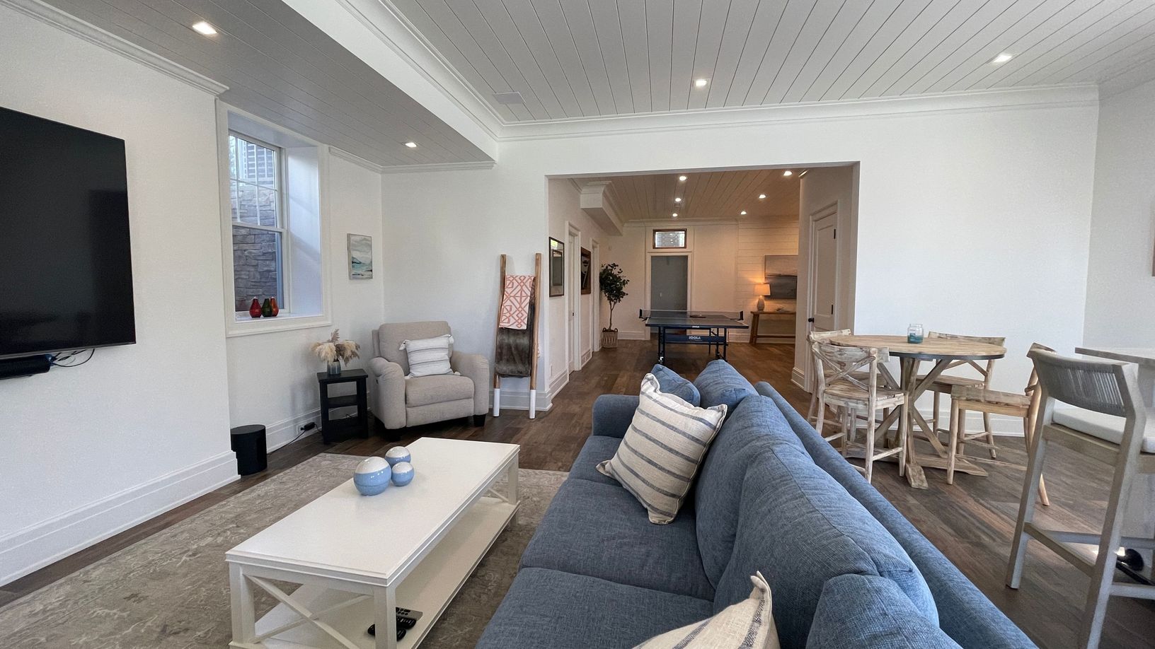  Rec. room with bar, oversized TV, half bath, laundry, and games