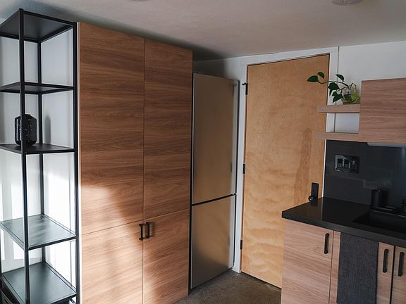 Fridge and closet/pantry storage.