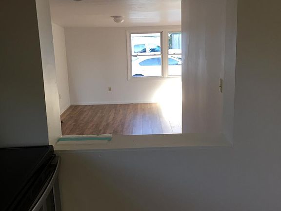 Kitchen looking into living room