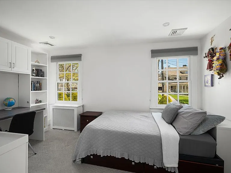 Second Bedroom with built-in desk and shelves.