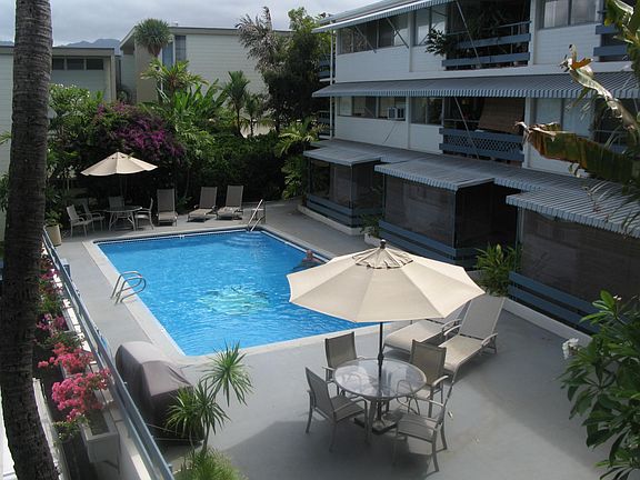 Community pool. The apartment is on the 2nd floor in the right edge of this photo, behind the palms.