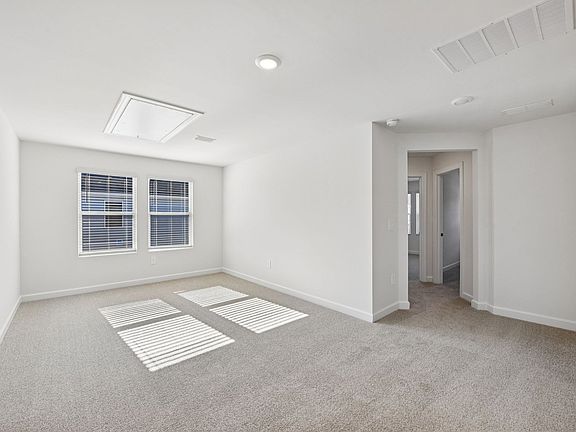 Convert the upstairs loft into a cozy lounge area.