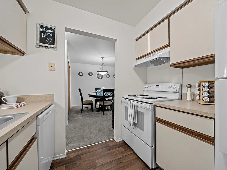 Cozy dining room connected to kitchen at Westwood Village Apartments in Westland, MI