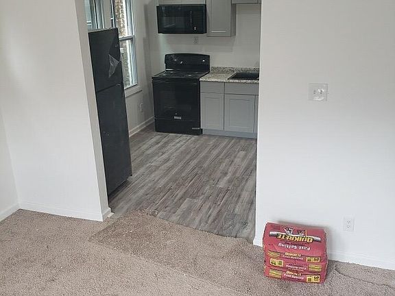 LIVING ROOM ENTRANCE TO KITCHEN