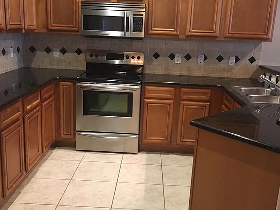 Kitchen Granite counters and SS appliances