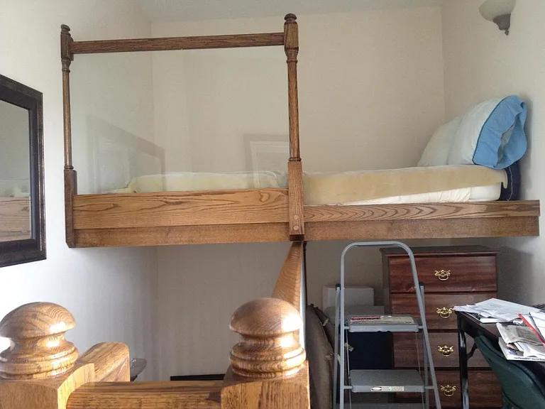 loft queen bed on penthouse roof area with river views