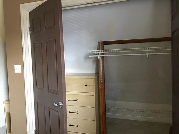 Large closet in main bedroom with additional chest of drawers