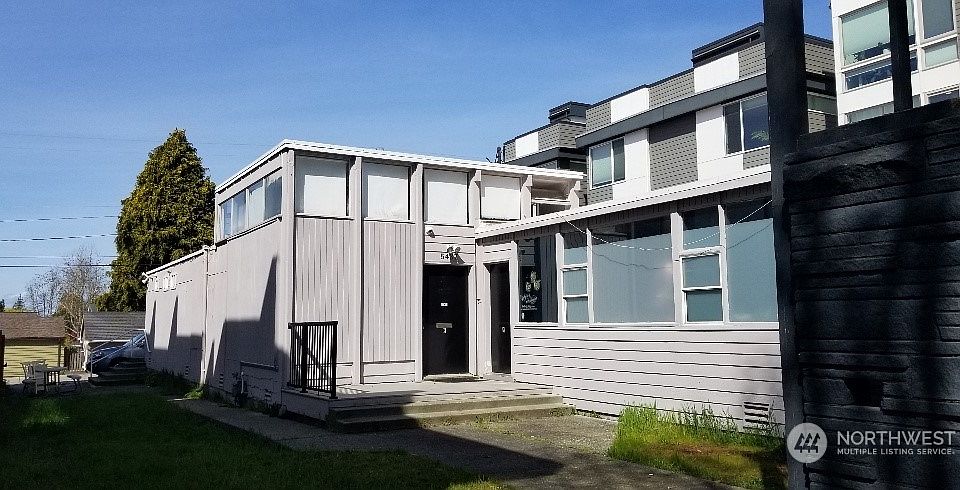 Building entrance. Seller says value in the land. Highest and best use would be development for Condo or Townhome project.>