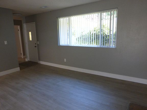 Entry into home and large flowing living and dining area.